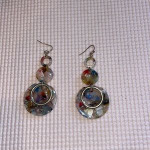 Long dangling acrylic earrings.